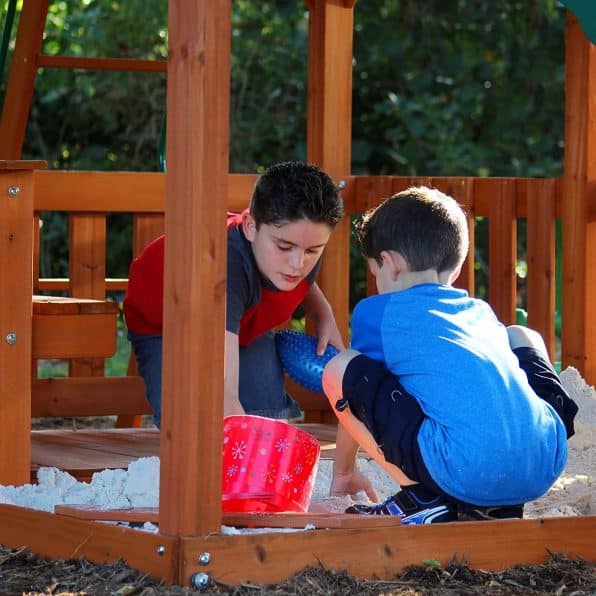 Siblings Playing Together on Swing Set for Older Kids